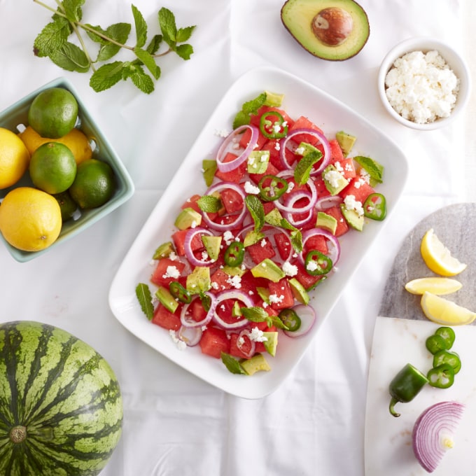 Watermelon avocado jalapeno salad on white plate