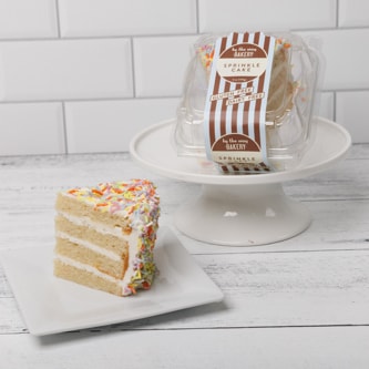 By The Way Bakery Sprinkle Cake Slice
